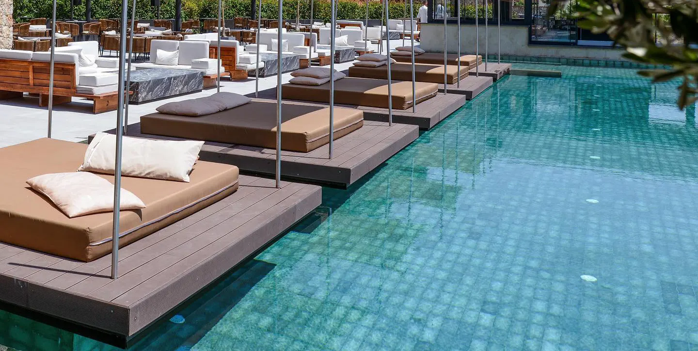 Pool deck with sunbeds at Nassau Hotel