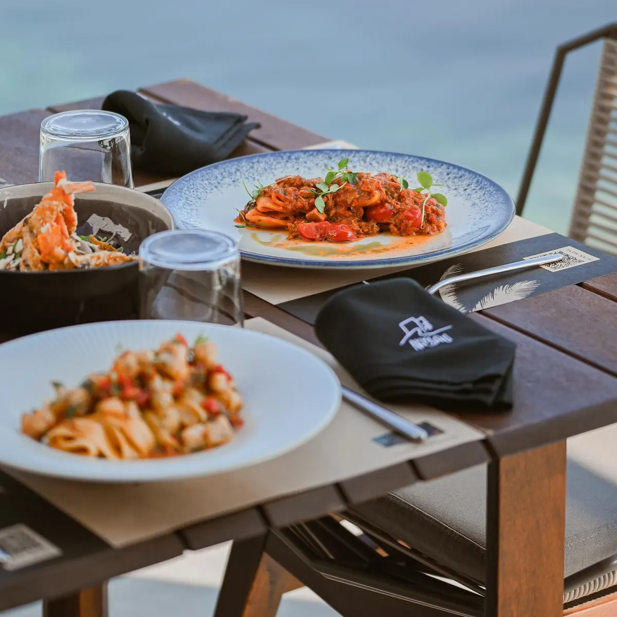 Seafood pasta and salad served at Nassau Restaurant
