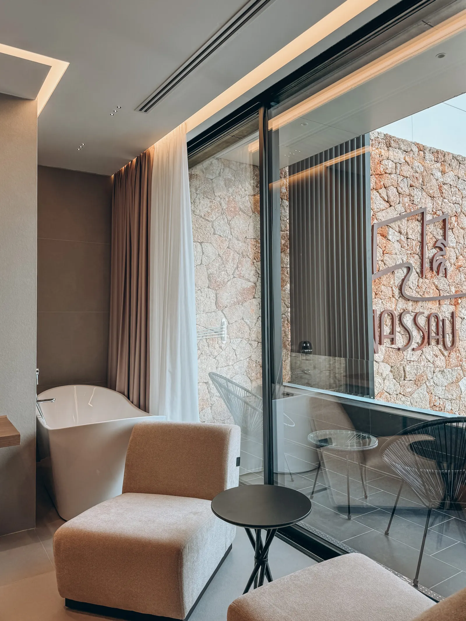 Suite lounge with sea-view balcony at Nassau Hotel